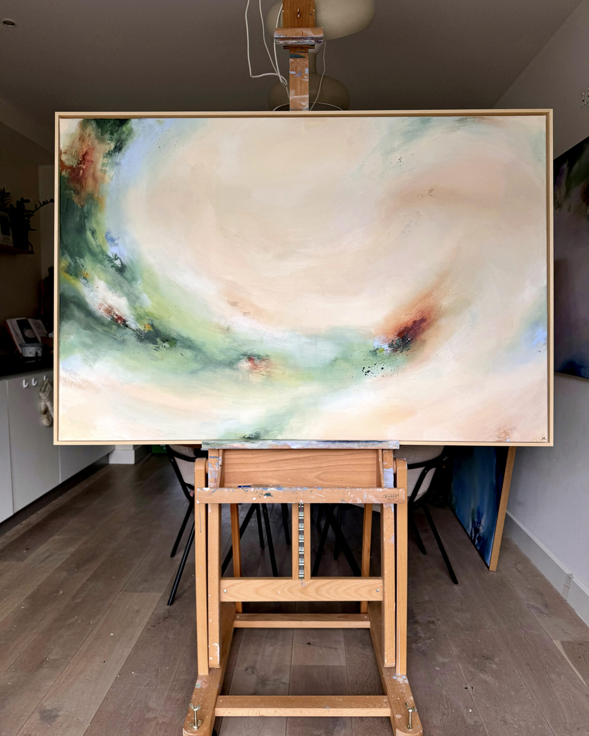 Two paintings against the wall